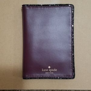 Kate Spade Plum passport-holder.